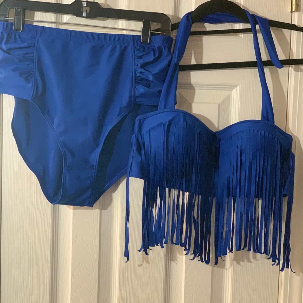 Two piece swimsuit with fringes.